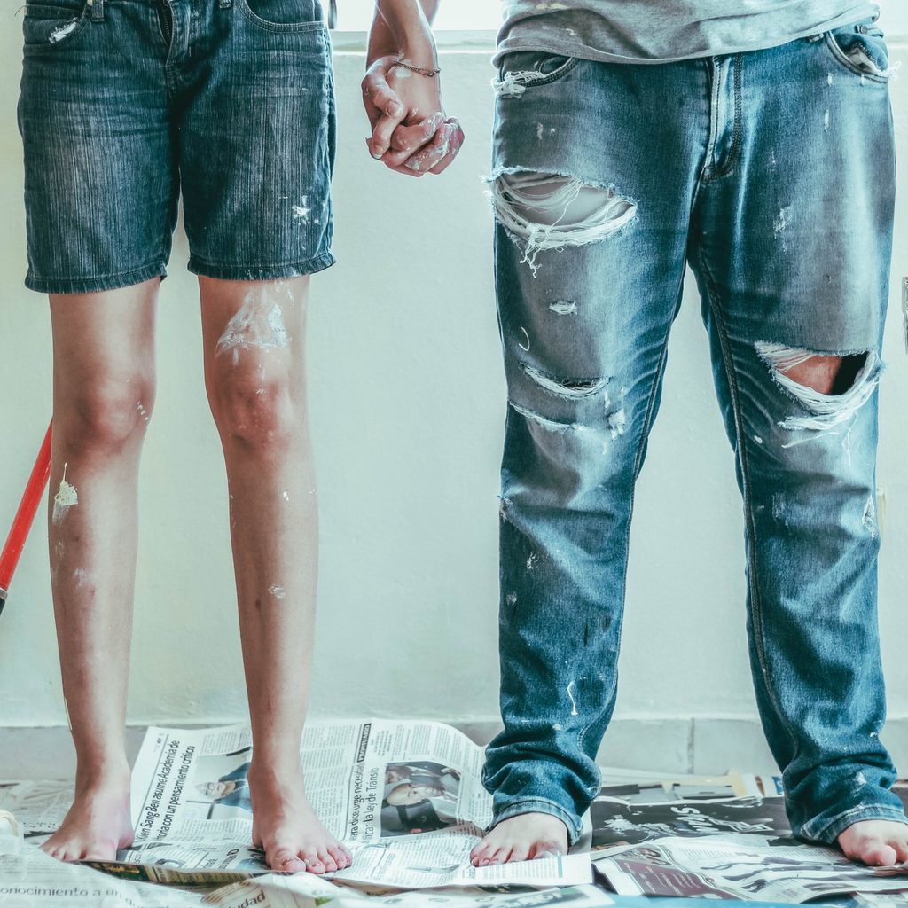 two people with paint on clothing