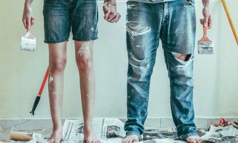two people with paint on clothing