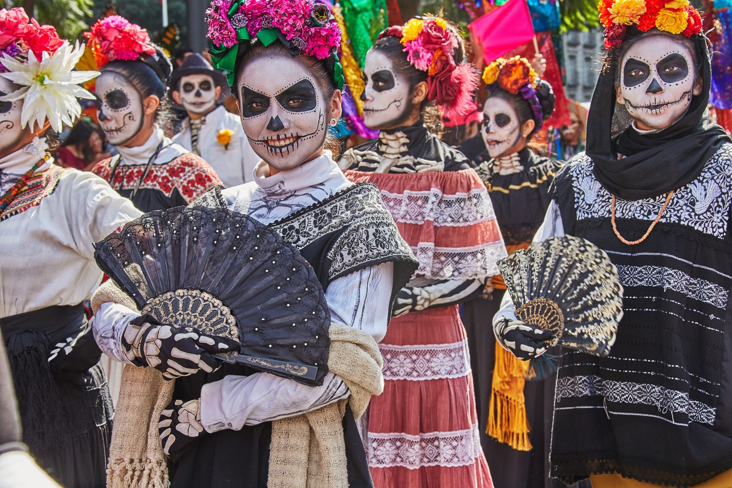 people dressed in costume for dia de los muertos