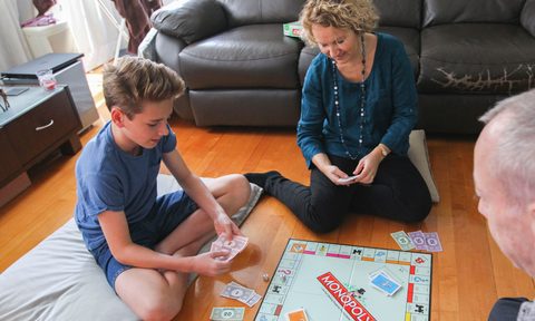 Family playing a board game