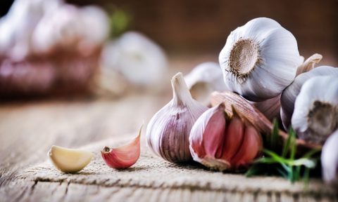 garlic on table and small cutting board
