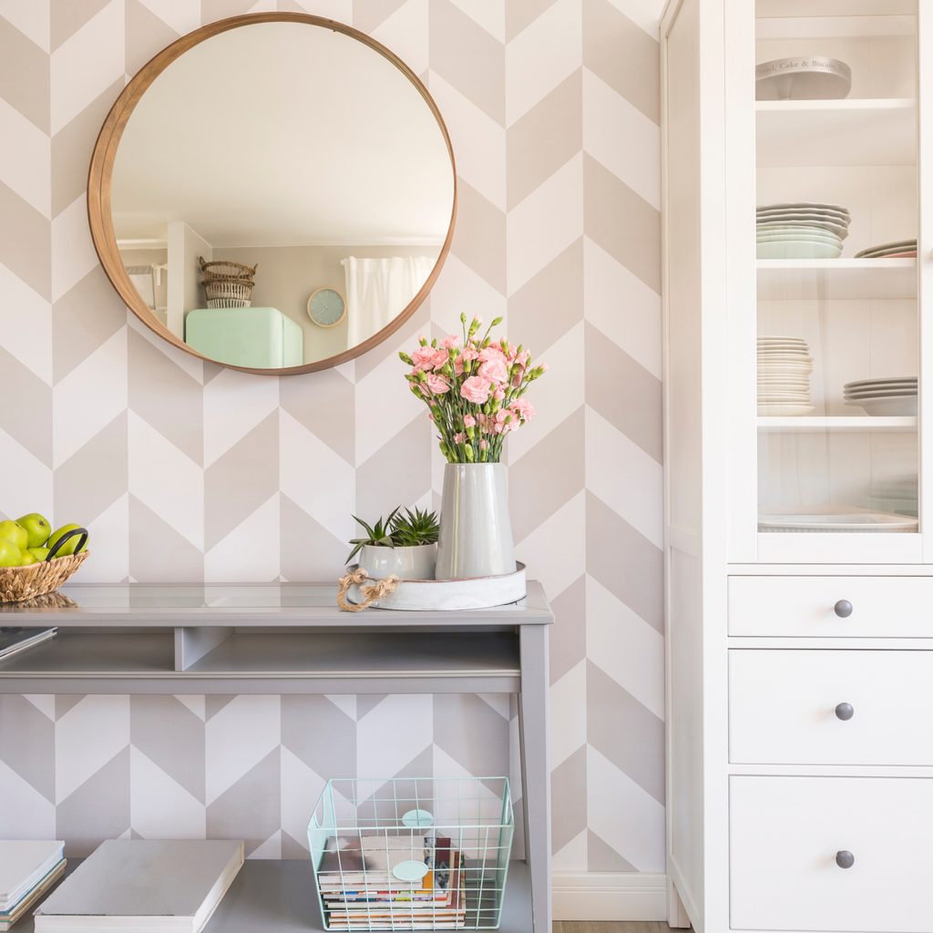 Geometric wallpaper with a console table