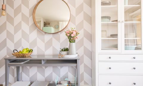 Geometric wallpaper with a console table