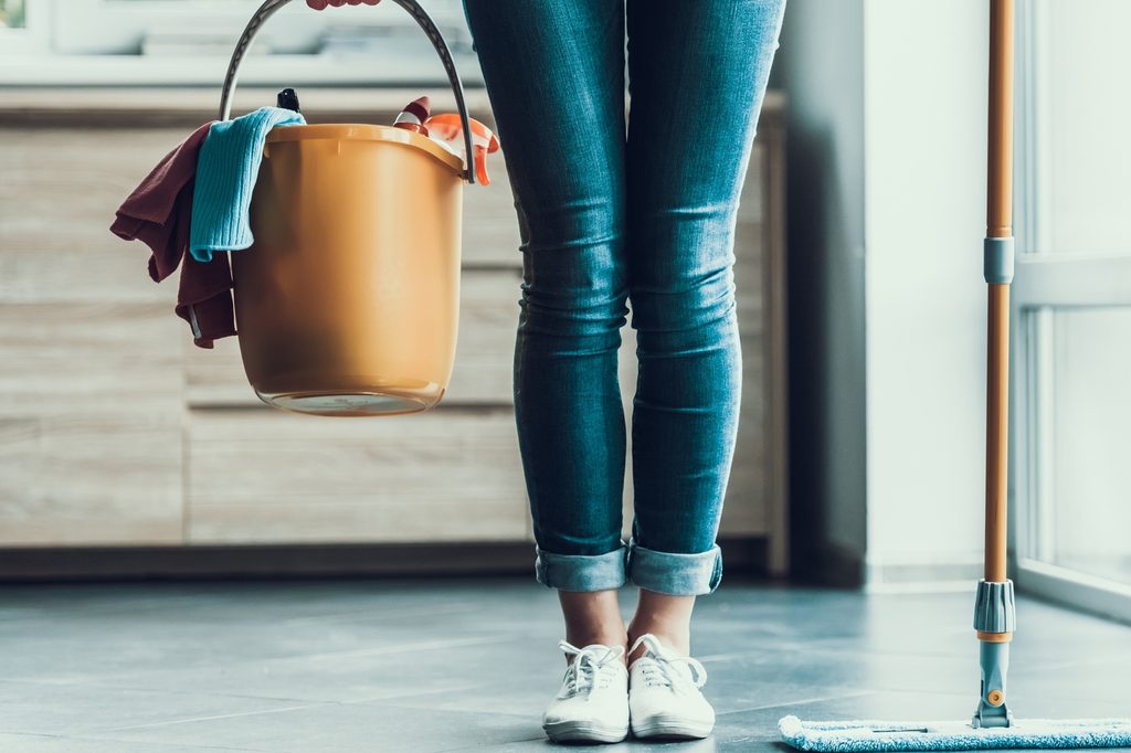 woman holding cleaning bucket
