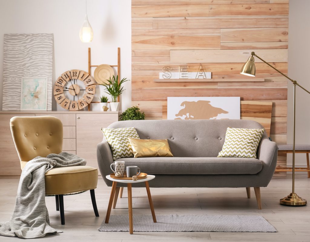 Stylish apartment living room with small, comfortable sofa