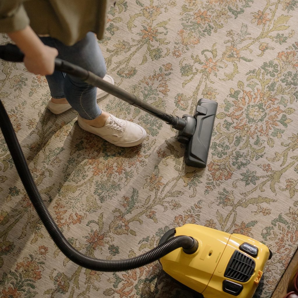 Person vacuuming