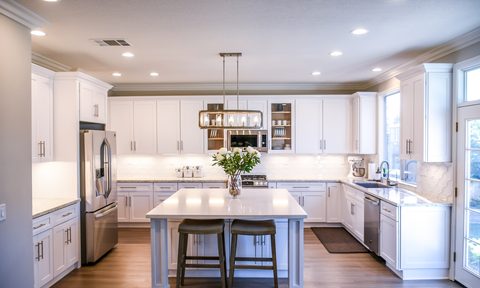 Clean white kitchen with hardwood floors