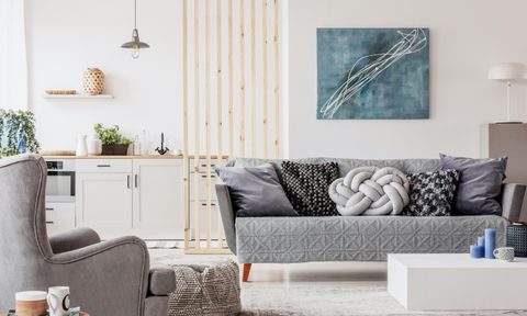 Couch and padded chair in a small apartment