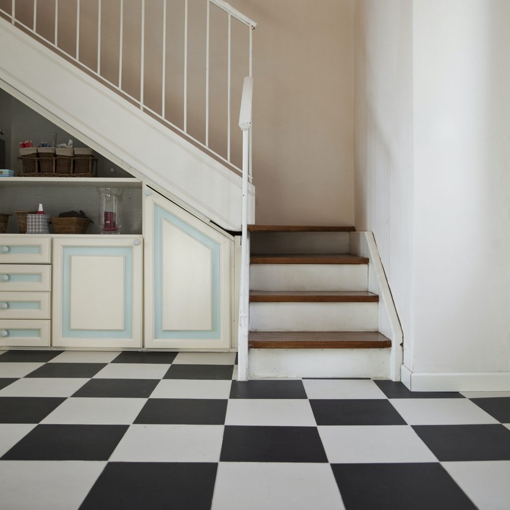 Checkerboard floor by stairway