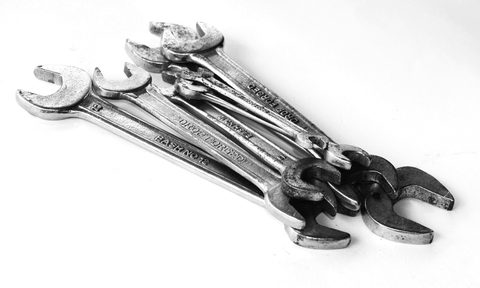 A group of wrenches on a table