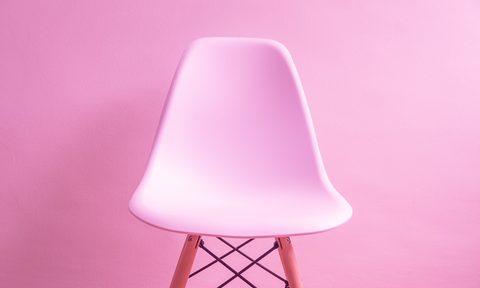 Pink chair against a pink wall