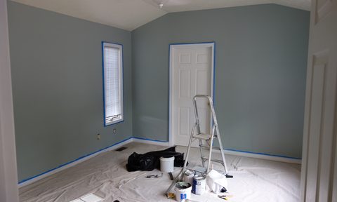 Bedroom with painting supplies on the floor