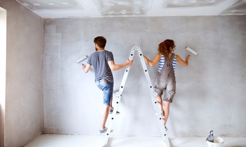 couple painting bedroom