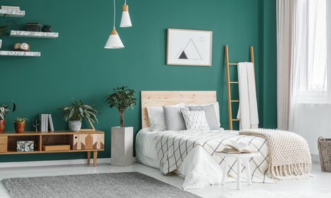 Green bedroom with headboard