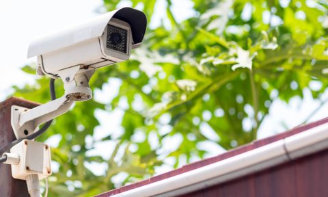 outdoor home security camera in backyard