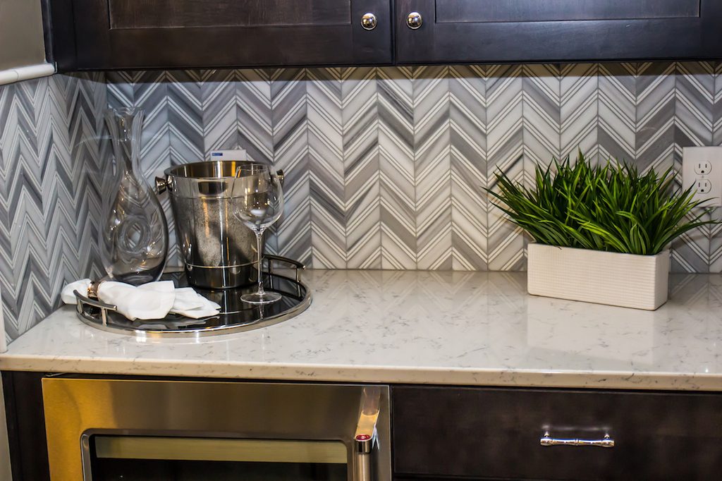 grey herringbone backsplash
