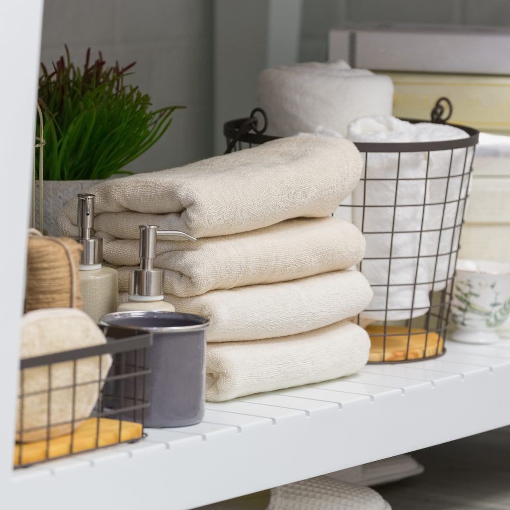 Folded towels on a bathroom shelf