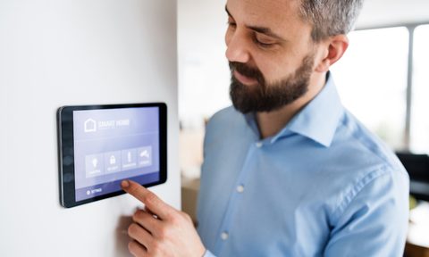 Smart thermostat on a wall