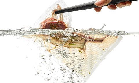 A sous vide bag cooking in water