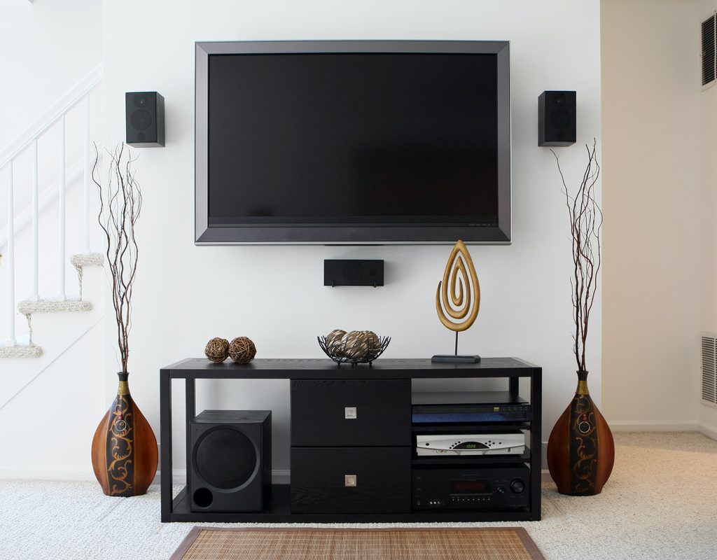 Wall-mounted TV with entertainment center below