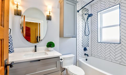 Bathroom with sconce lights
