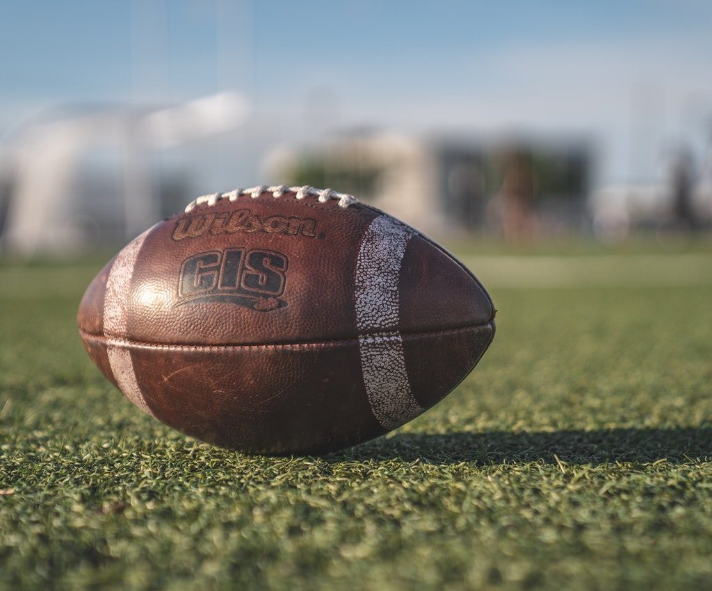 football on green turf outdoors