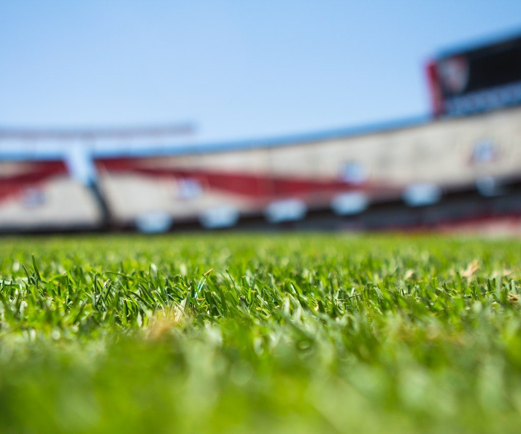 football stadium turf with empty stands
