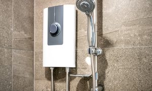 Tankless water heater next to a shower