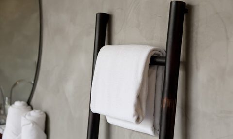 White towel hanging on bathroom towel ladder