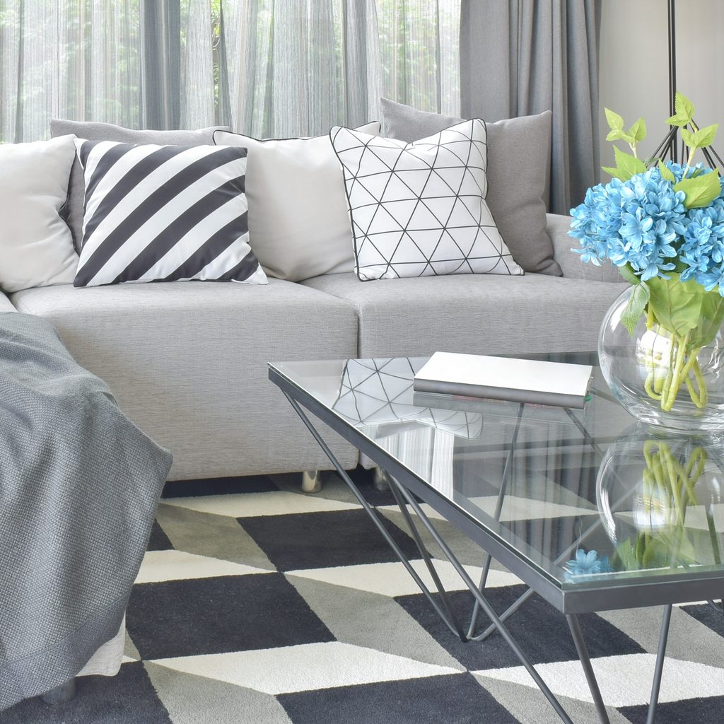 grey sofa and carpet tiles in living room