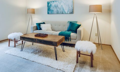 living room with art over couch