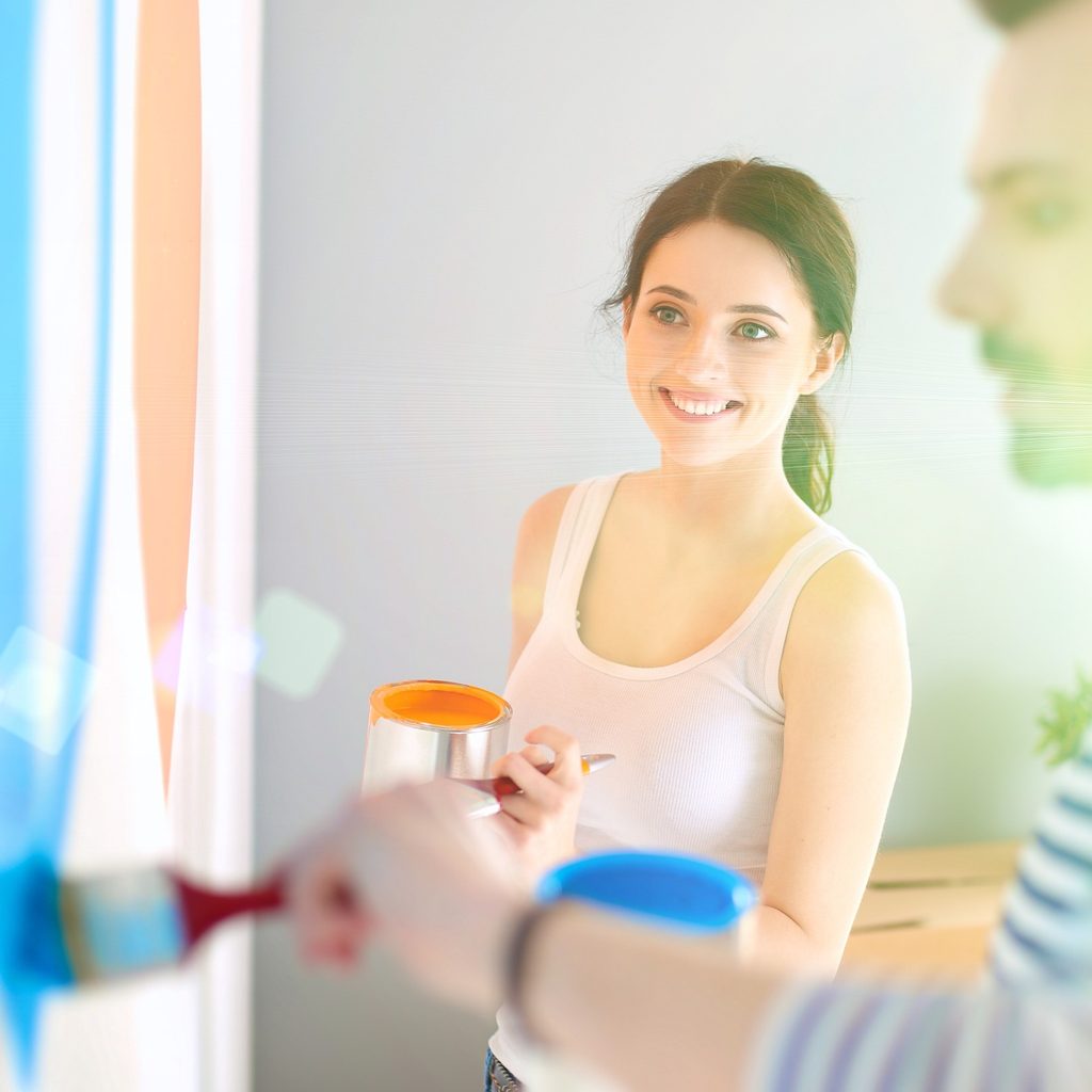 man and woman painting with two colors