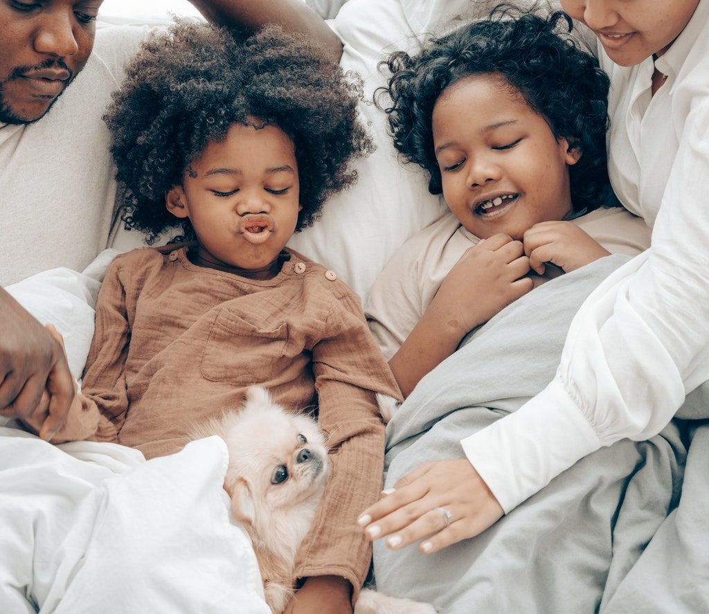 ethnic family with small dog