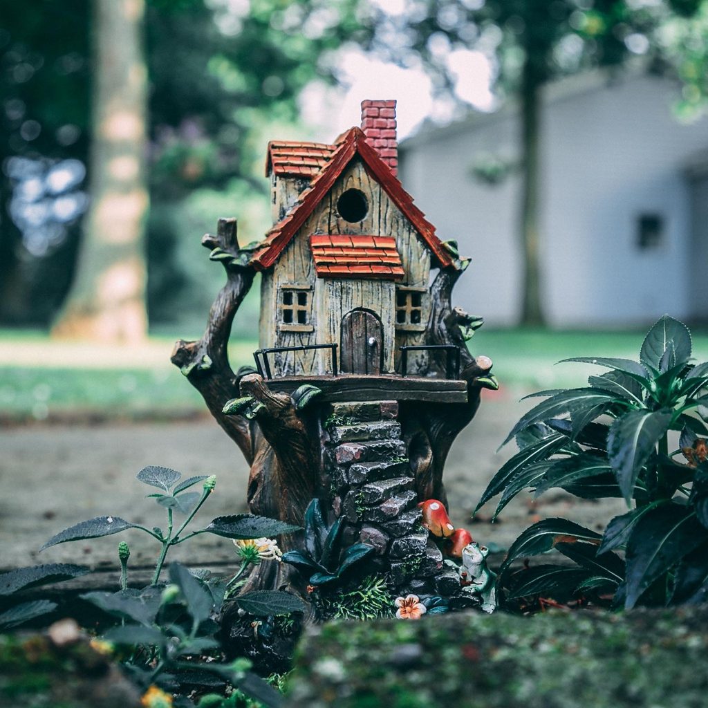 picture of a tiny birdhouse in garden