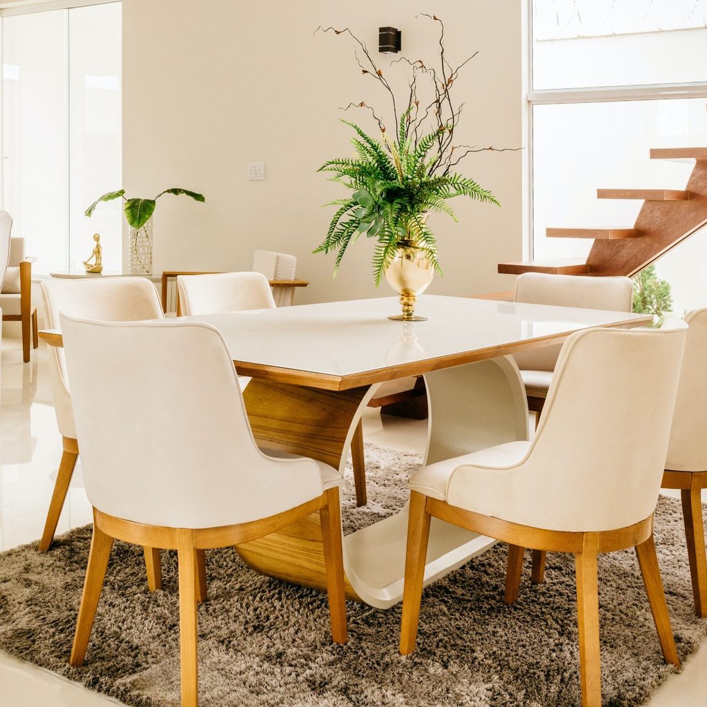 White dining room with beige rug