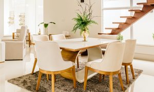 White dining room with beige rug