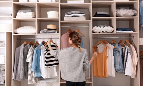 woman organizing closet