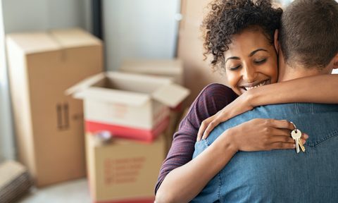 online housewarming party inspiration couple embracing home key