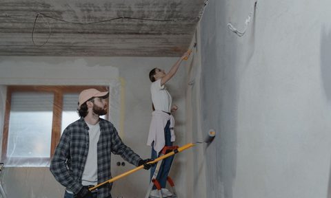 Couple painting the interior