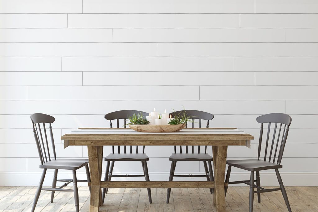 dining room with shiplap walls