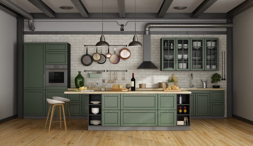 Organized kitchen with sage green cabinets