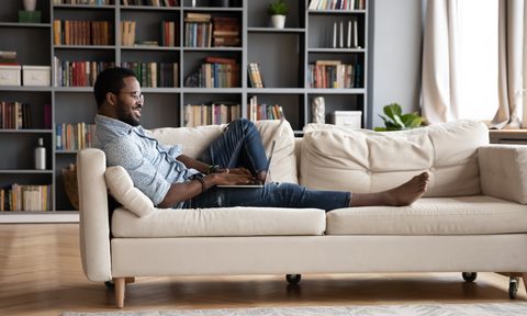 man lounging on couch