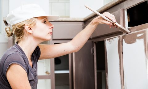 affordable kitchen cabinets replace woman painting