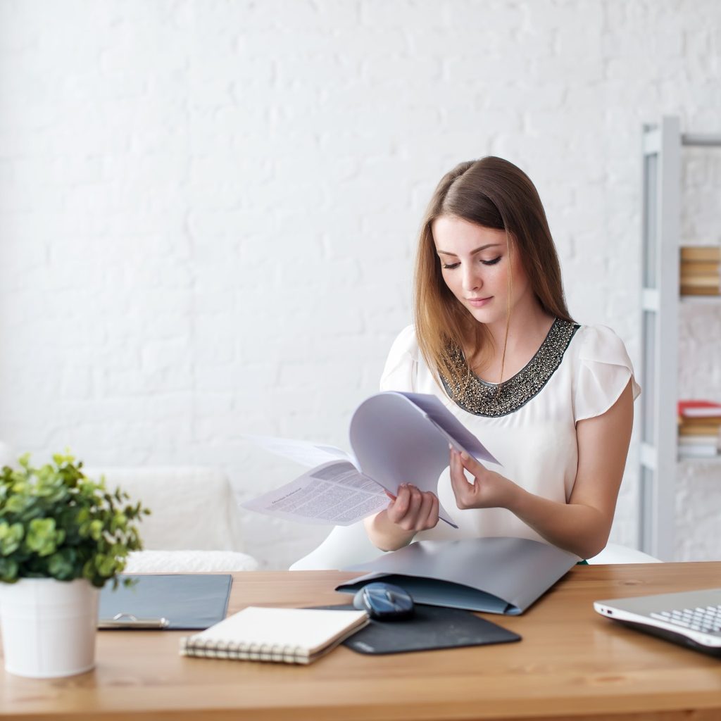 woman sorting paperwork