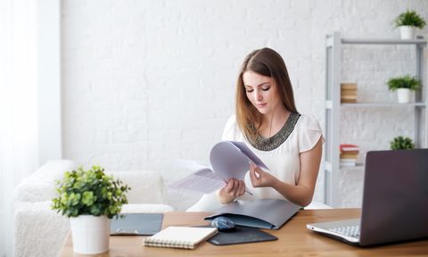 woman sorting paperwork