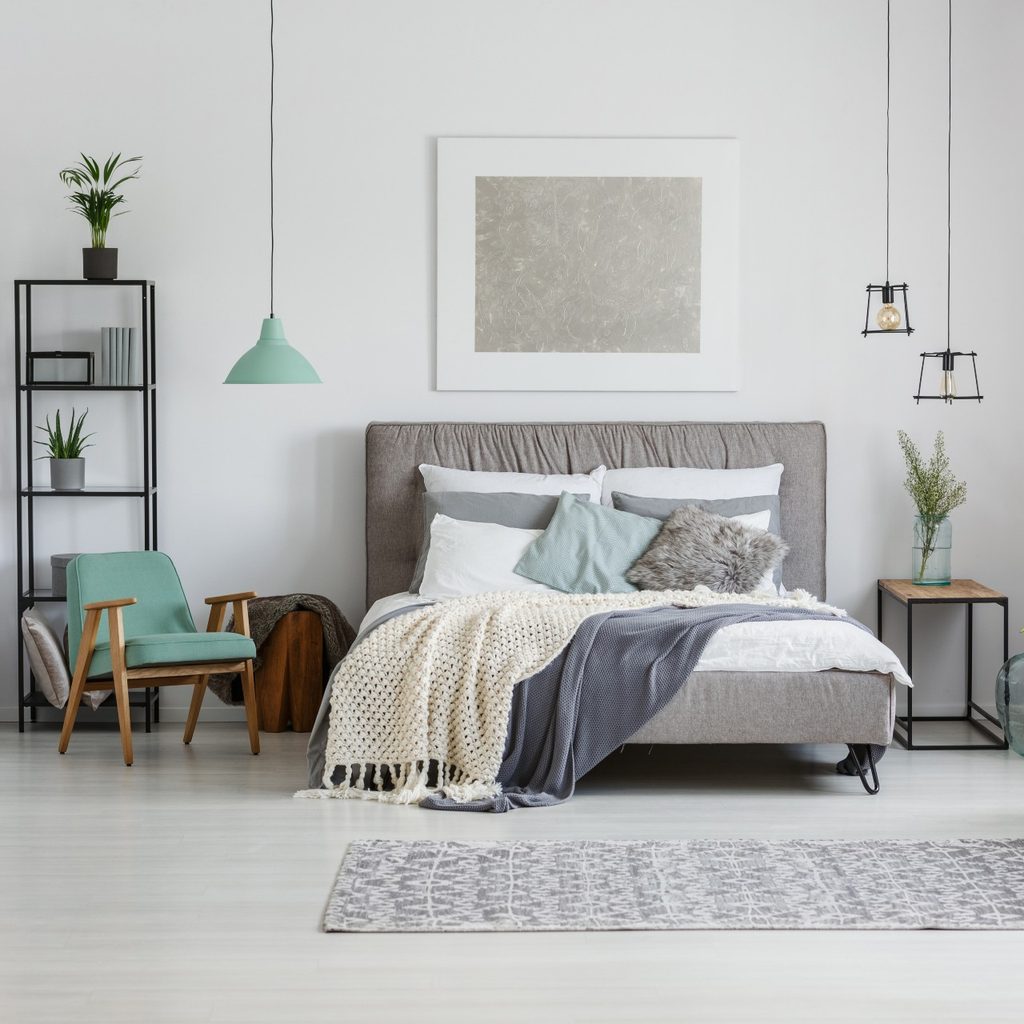 neutral bedroom with pop of blue