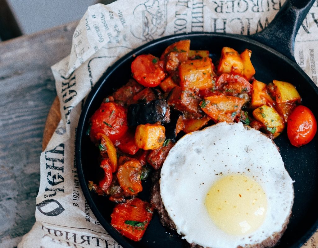 cast iron pan with cooked meal