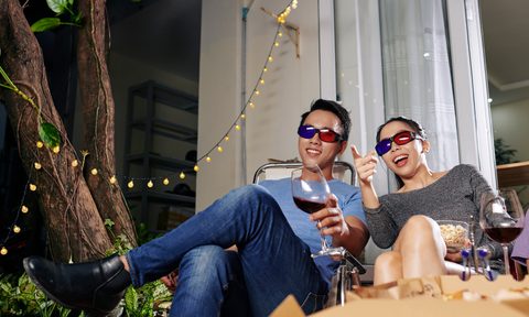 how to turn your backyard into an outdoor movie theater couple