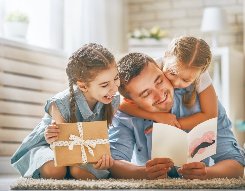 kids giving their dad a fathers day gift