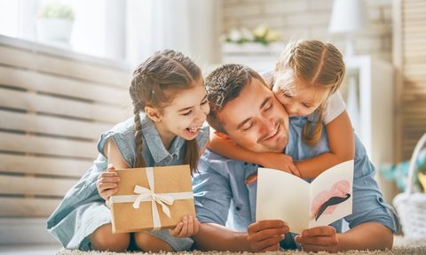 Kids giving their dad a Father's day gift